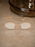Celebrity Clear Gold-Toned Metal Rimless UV Protected  Oval Luxe Sunglasses For Women CL114GD-TP